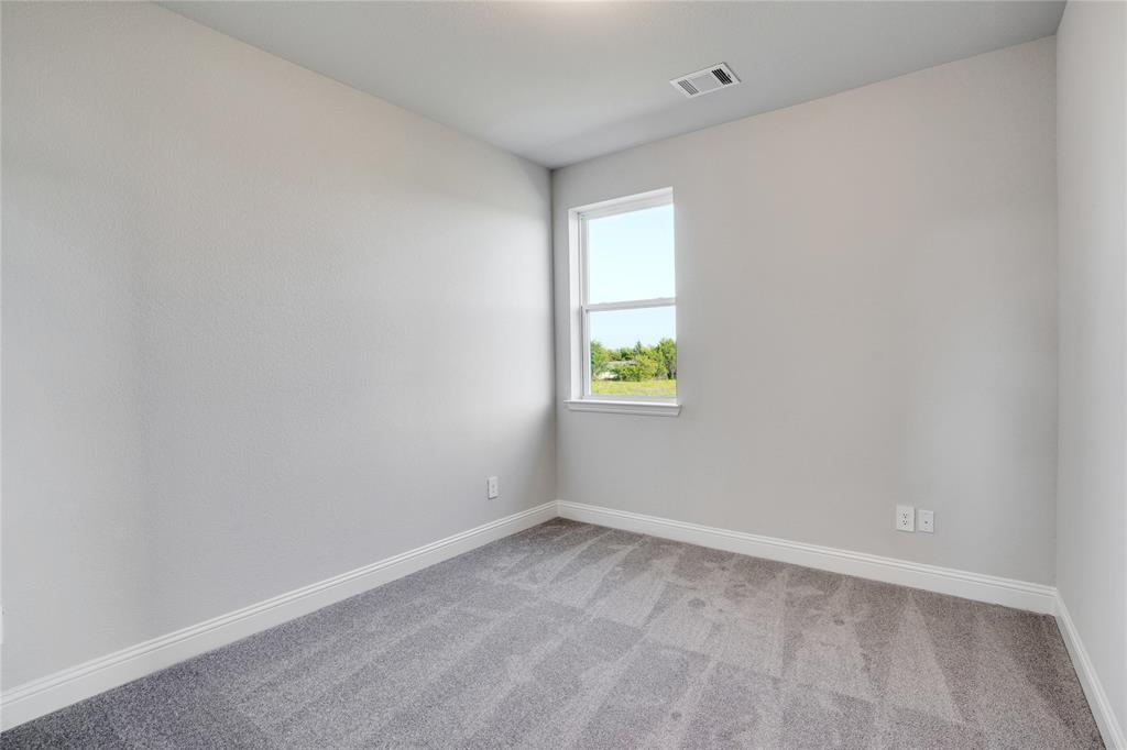 8526 Royal Star Road Rowlett, TX 75089 - Photo 13 of 21 a view of an empty room with a window