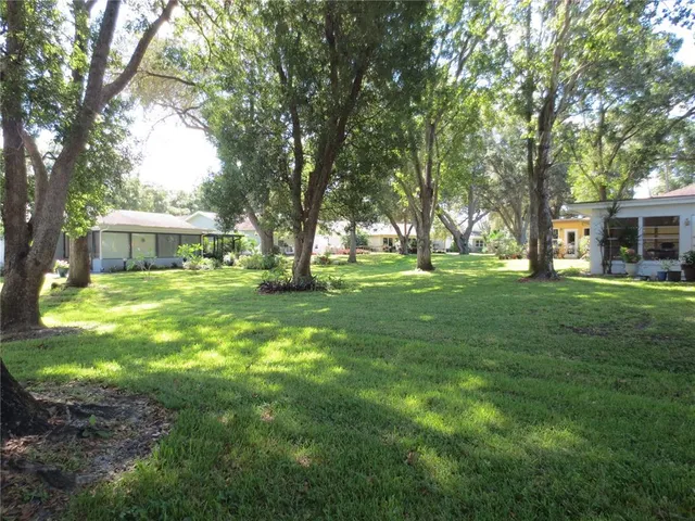 a view of a house with a big yard