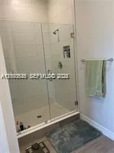a bedroom with a bed and a cabinets