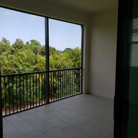 a view of a patio with a table and chairs