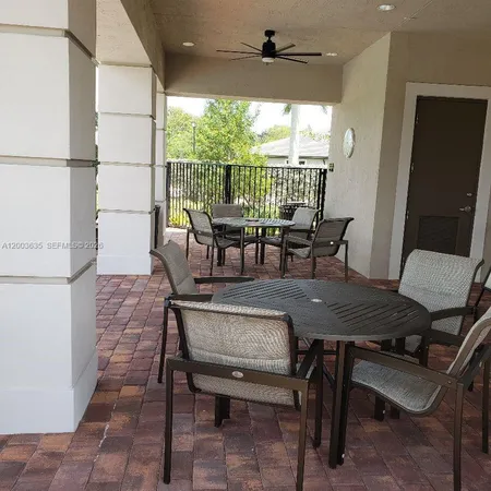 a view of swimming pool with chairs