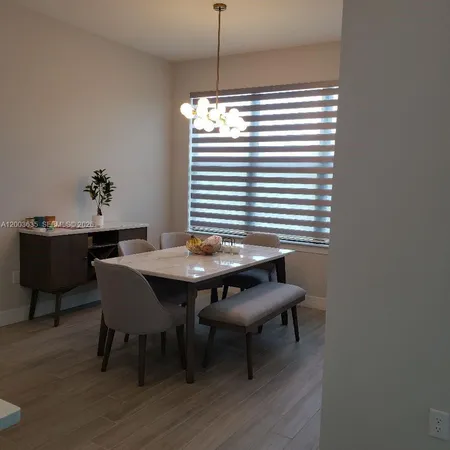 a kitchen with a sink cabinets and window
