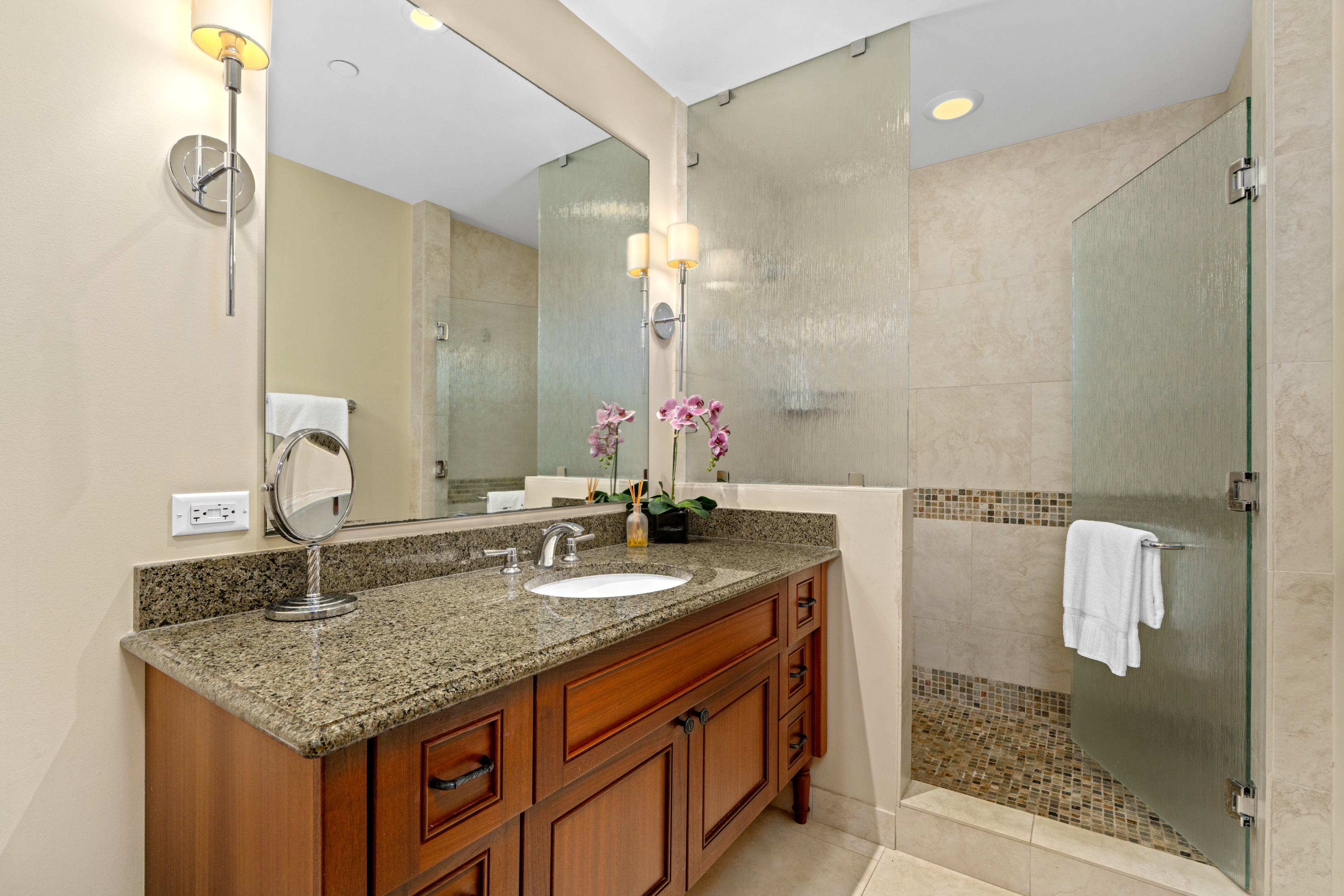 2641 Poipu Road, Unit 1107 Koloa, HI 96756 - Photo 13 of 22 a bathroom with a granite countertop sink and a mirror