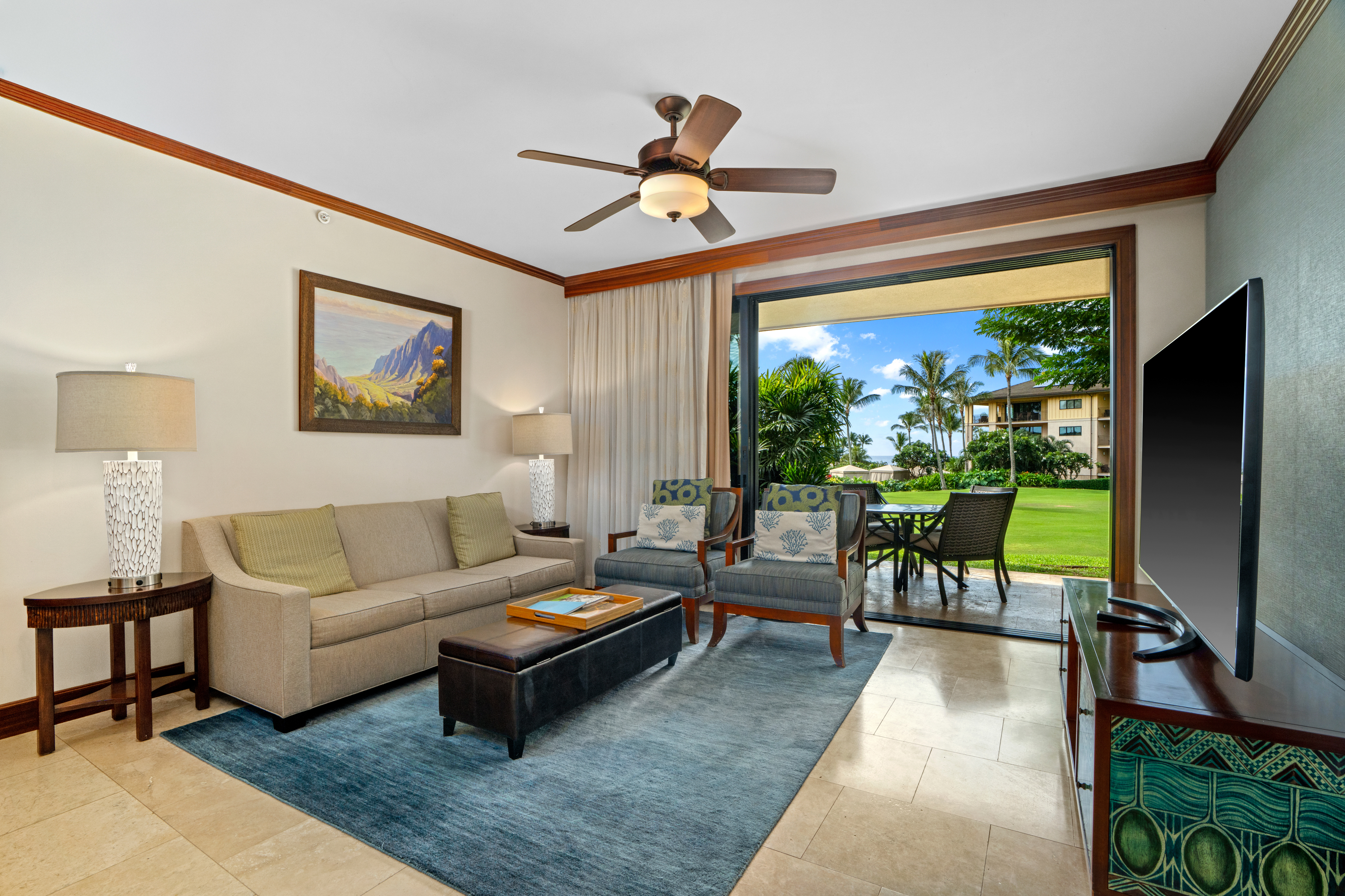 2641 Poipu Road, Unit 1107 Koloa, HI 96756 - Photo 6 of 22 a living room with furniture a rug and a flat screen tv