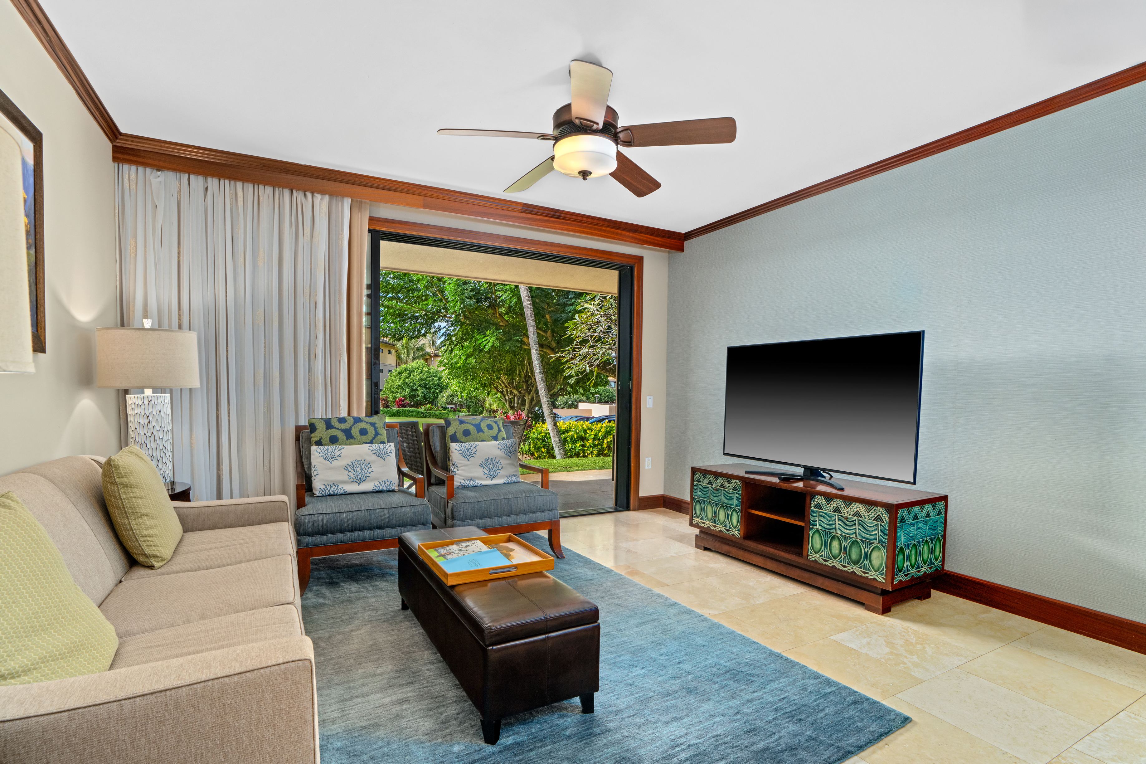 2641 Poipu Road, Unit 1107 Koloa, HI 96756 - Photo 7 of 22 a living room with furniture and a flat screen tv