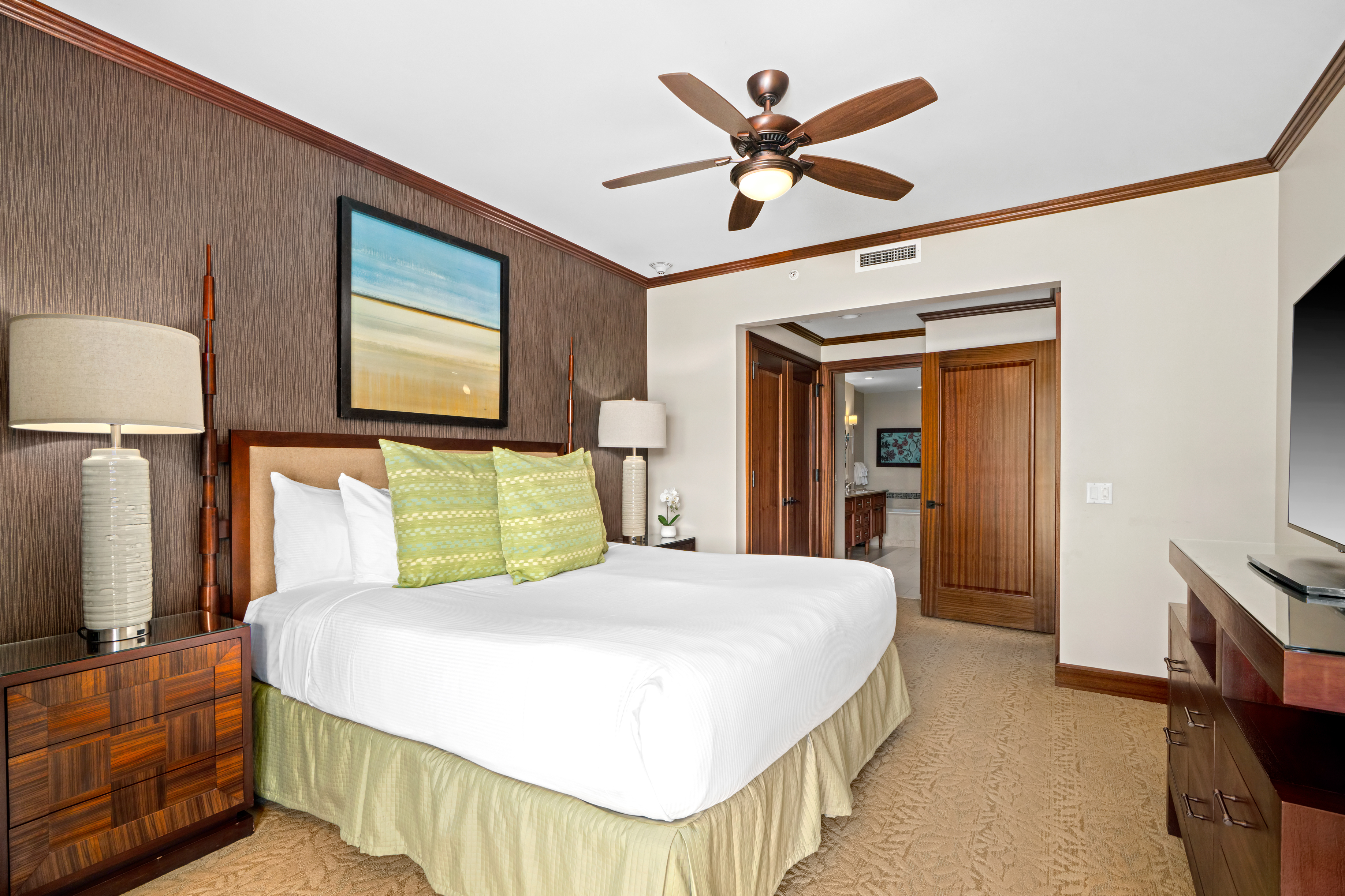 2641 Poipu Road, Unit 1107 Koloa, HI 96756 - Photo 8 of 22 a bedroom with a bed and a flat screen tv