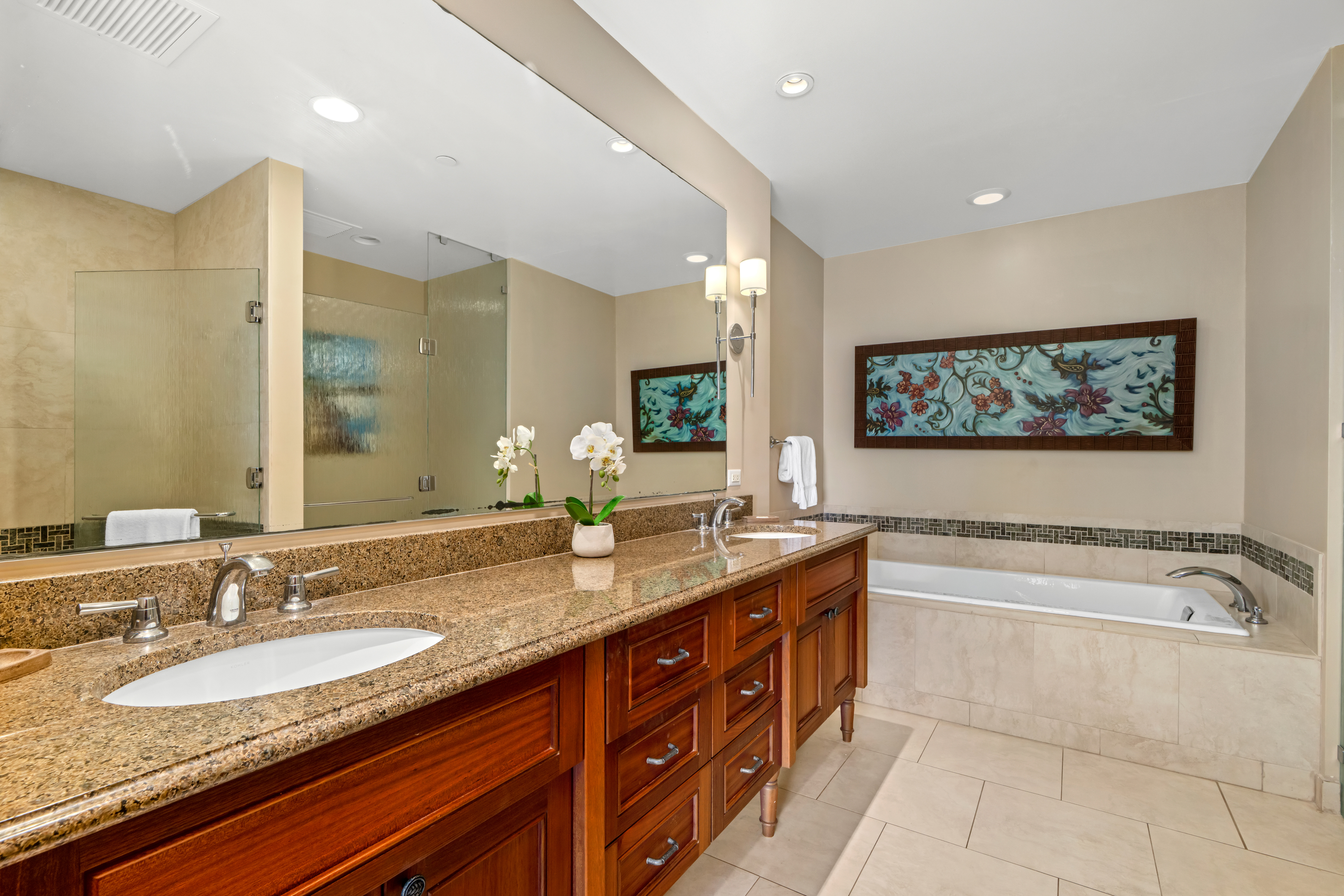 2641 Poipu Road, Unit 1107 Koloa, HI 96756 - Photo 10 of 22 a bathroom with a granite countertop bathtub sink double and mirror