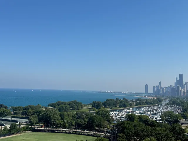 a view of a city with tall buildings in background
