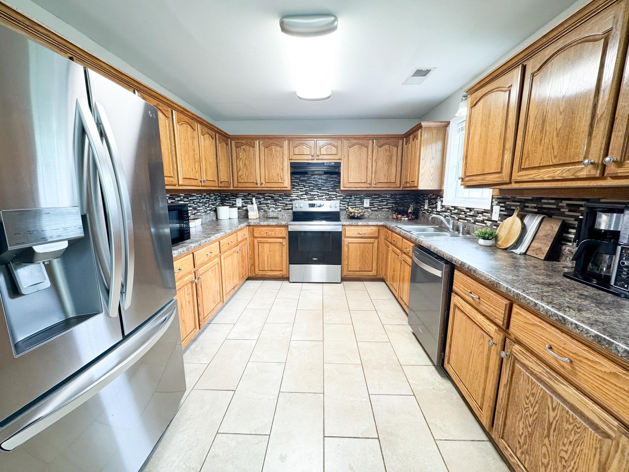 4776 Campground Road Munford, TN 38058 - Photo 5 of 25 a large kitchen with granite countertop lots of counter top space