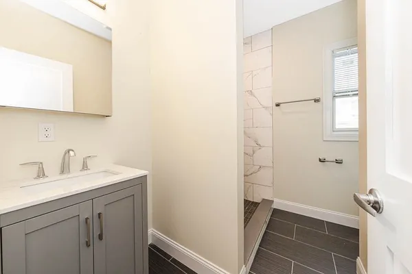 a bathroom with a sink and a mirror