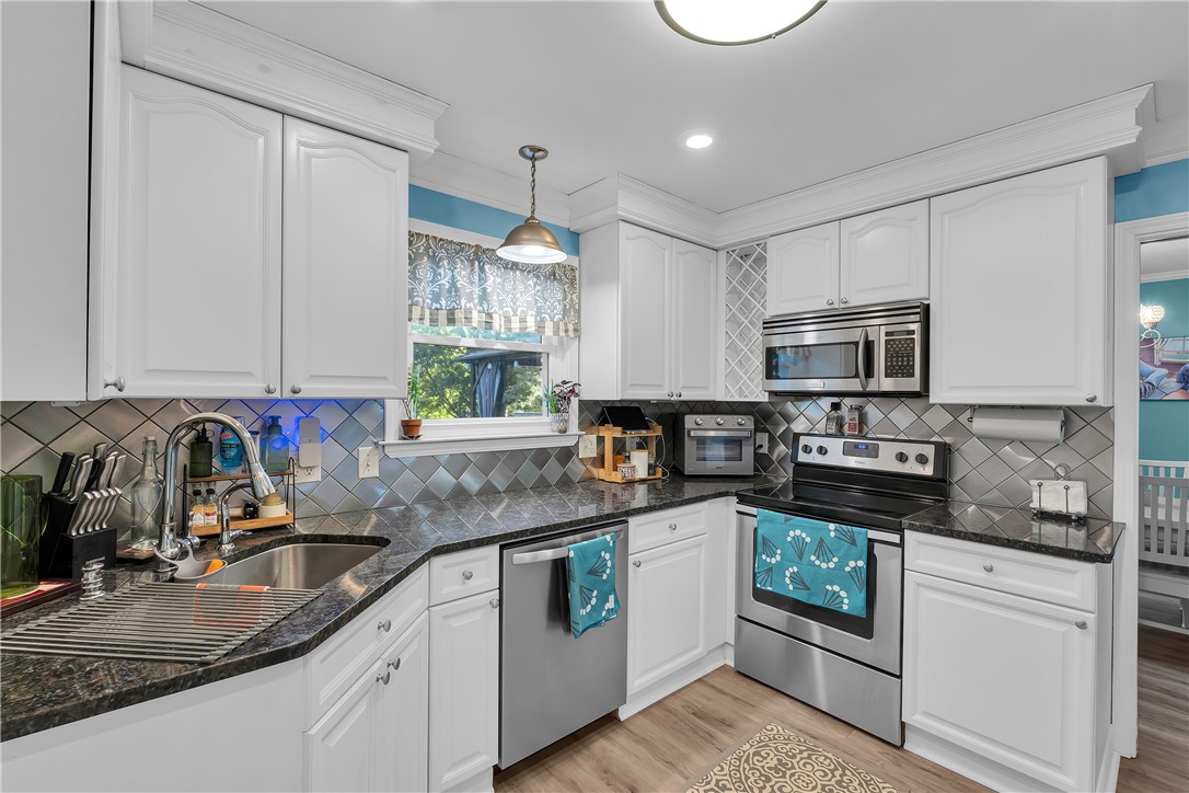 1305 Hanover Road Anderson, SC 29621 - Photo 8 of 29 Granite countertops and detailed crown molding elevate this functional workspace.
