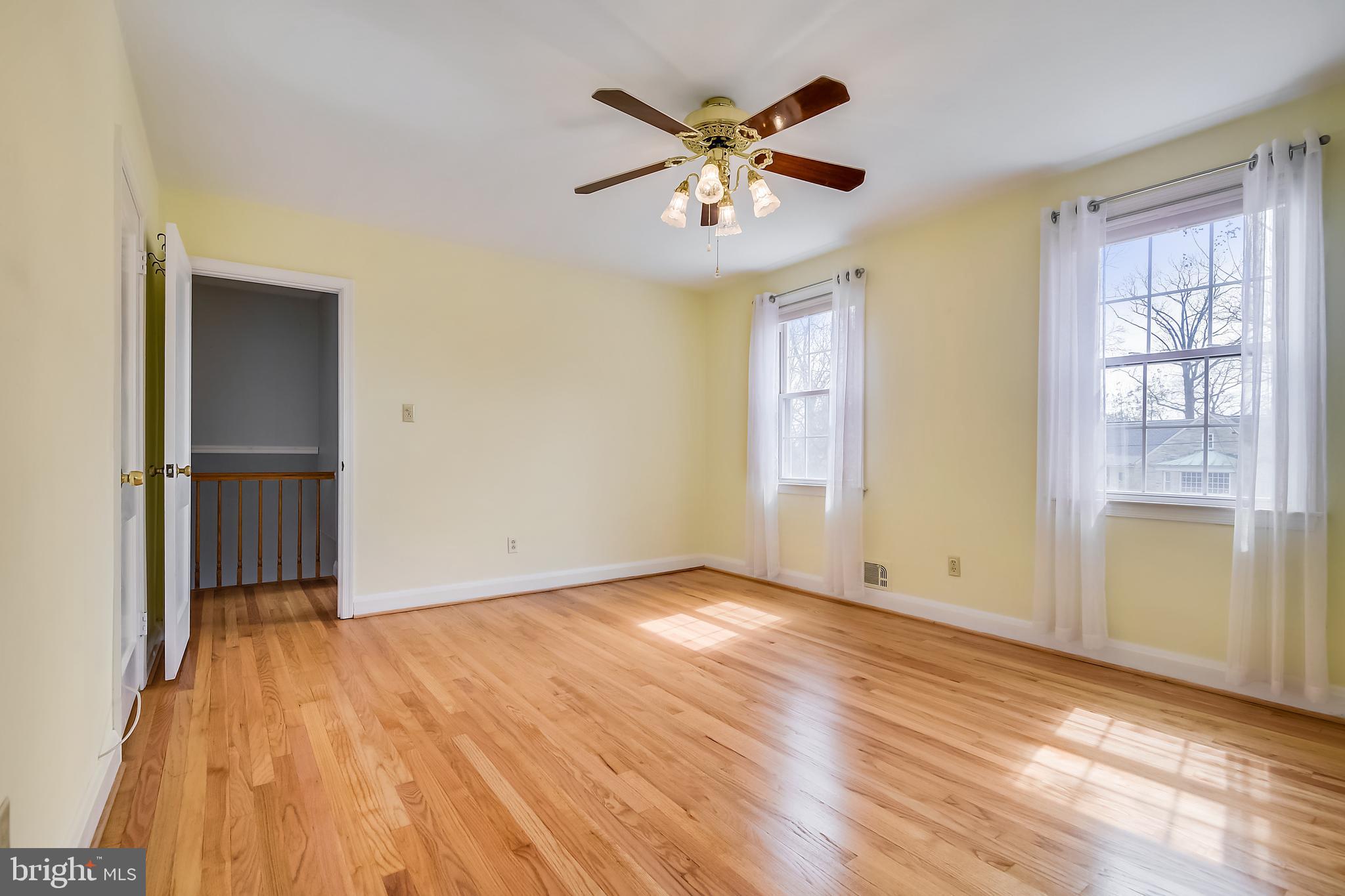 1622 Myamby Road Baltimore, MD 21286 - Photo 10 of 28 a view of an empty room with wooden floor and a window