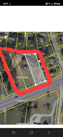 a view of a tennis ground with large trees