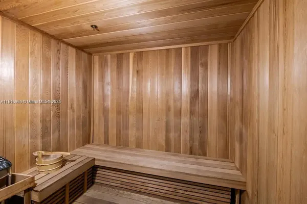 a view of a room with wooden walls