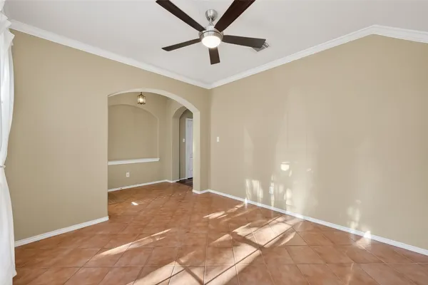 a view of a room with a ceiling fan