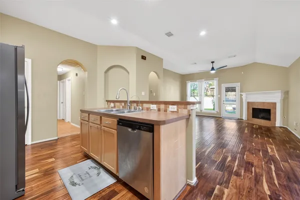 a spacious bathroom with a sink and a mirror