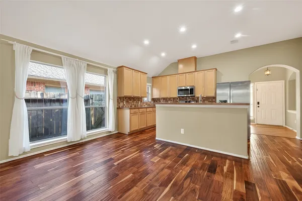 a view of kitchen with wooden floor