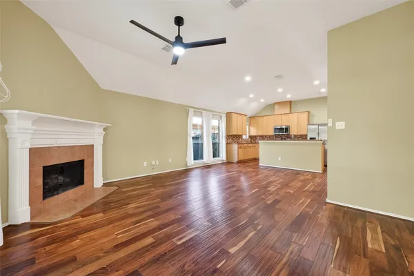 a view of a kitchen with a stove cabinets and wooden floor