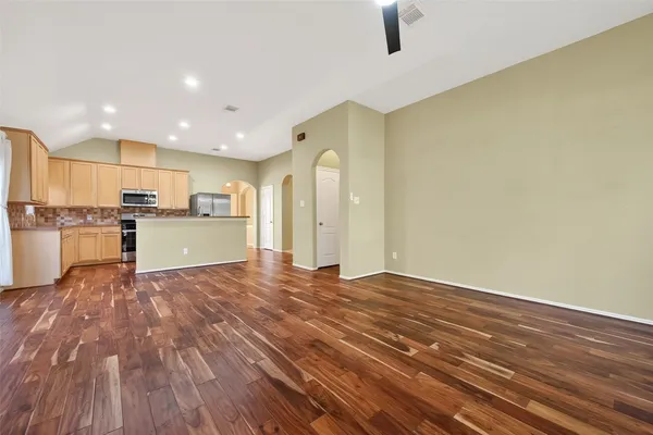 a view of kitchen with wooden floor