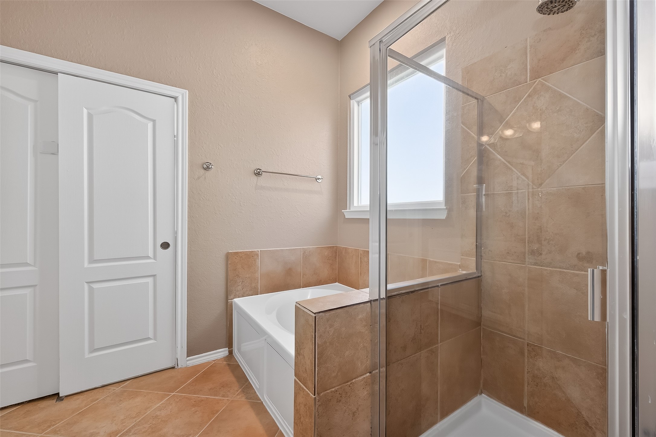 2311 Cory Crossing Lane Spring, TX 77386 - Photo 30 of 48 a bathroom with a bathtub and shower