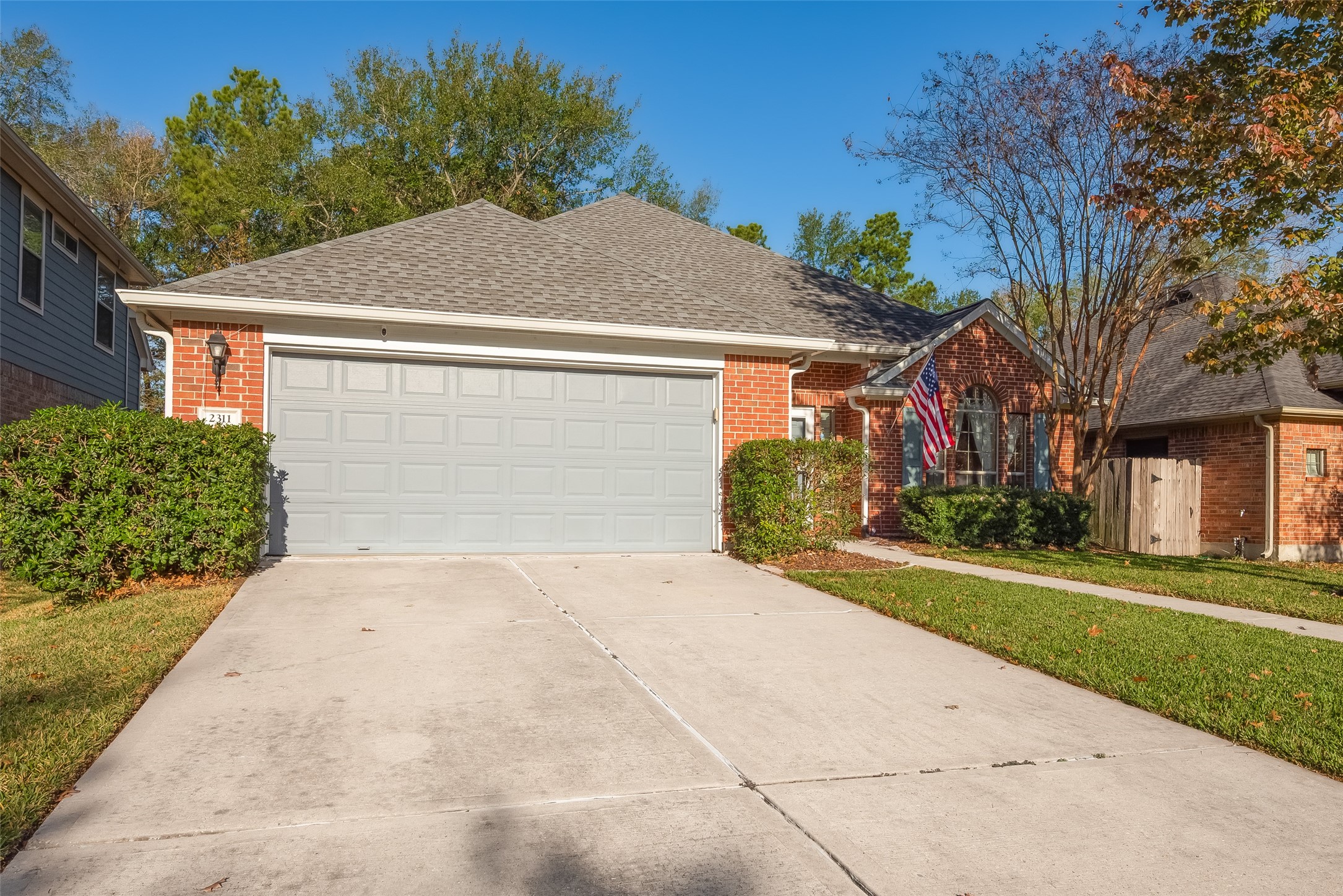 2311 Cory Crossing Lane Spring, TX 77386 - Photo 3 of 48 a front view of a house with a yard and garage