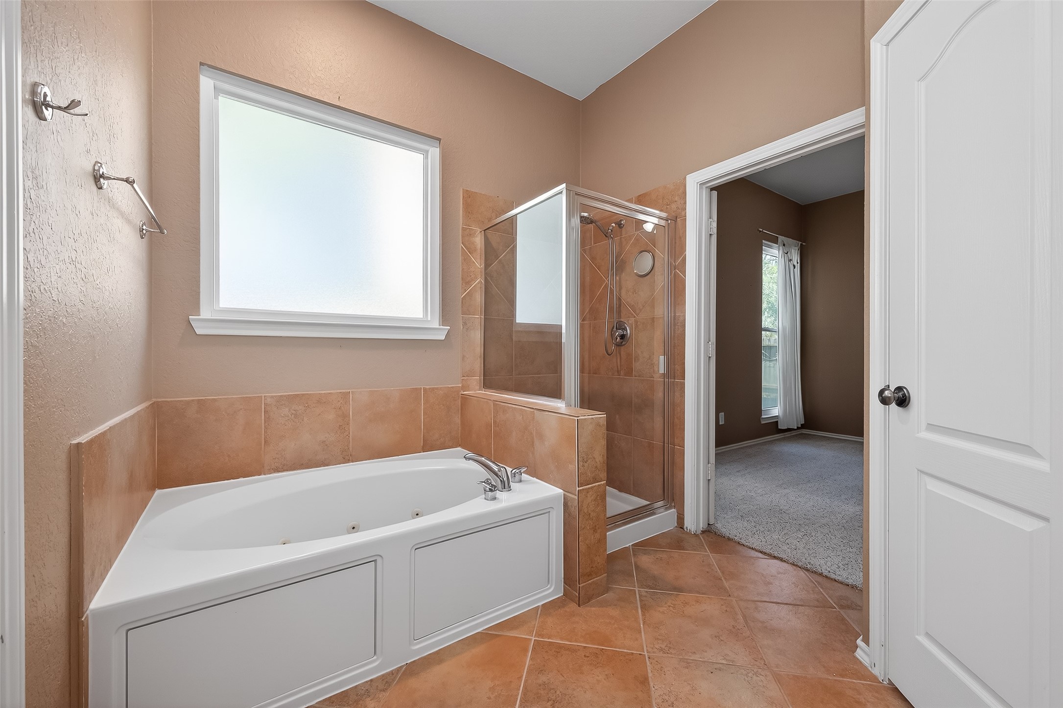 2311 Cory Crossing Lane Spring, TX 77386 - Photo 33 of 48 a bathroom with a bathtub and a shower