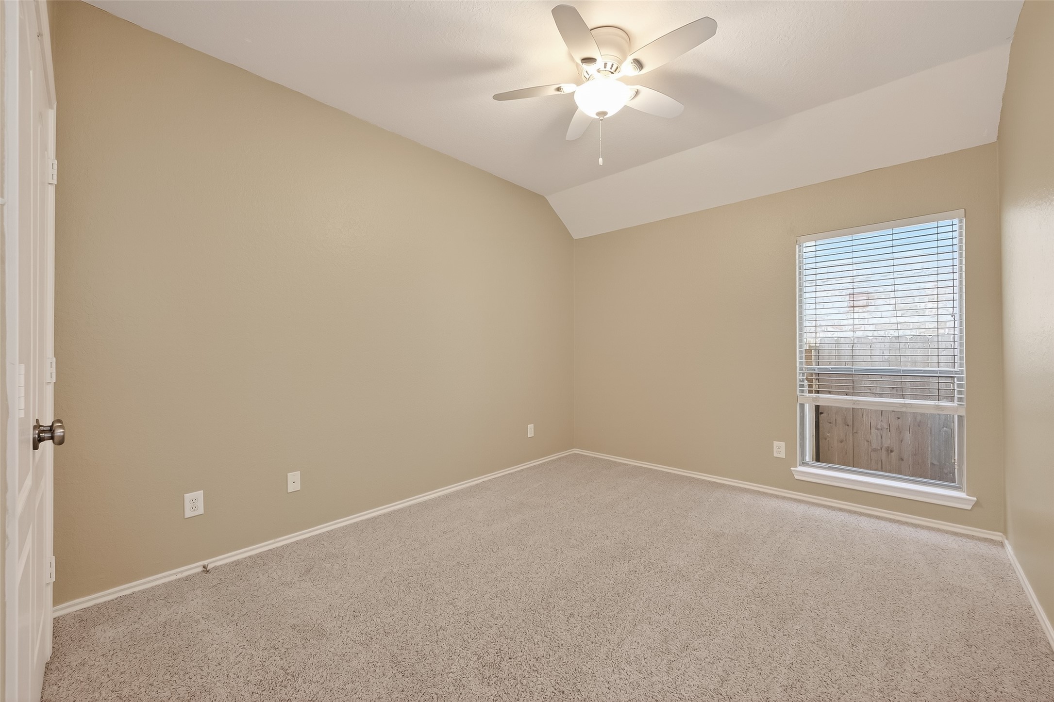 2311 Cory Crossing Lane Spring, TX 77386 - Photo 39 of 48 an empty room with a window and a ceiling fan