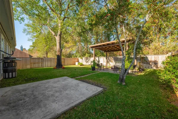 a view of backyard with a patio