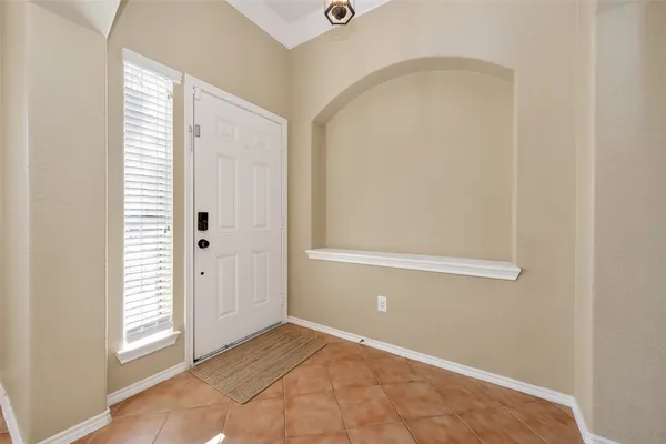 a view of an empty room with window