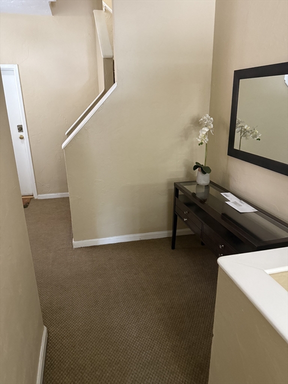 160 Cottage Street, Unit 2 Boston, MA 02128 - Photo 2 of 11 a view of an empty room with wooden floor