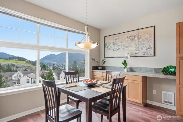 a view of a dining room with furniture window and outside view