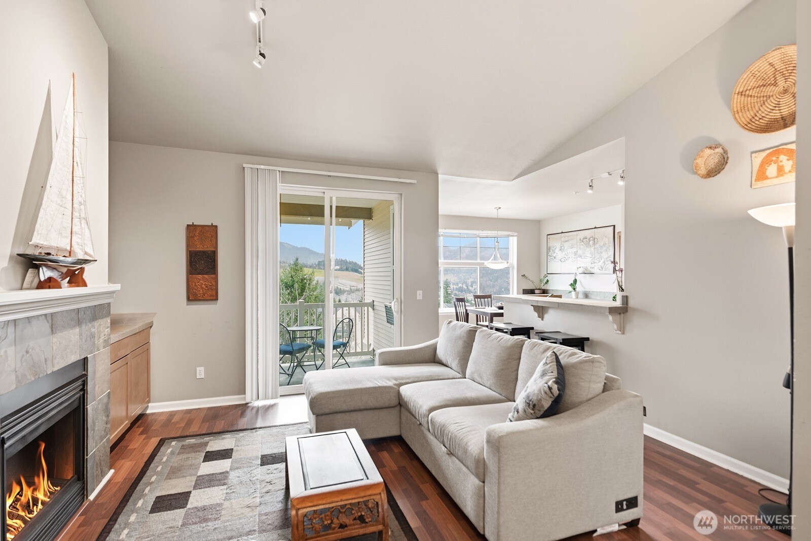 23420 Southeast Black Nugget Road, Unit F302 Issaquah, WA 98029 - Photo 11 of 19 a living room with furniture and a fireplace
