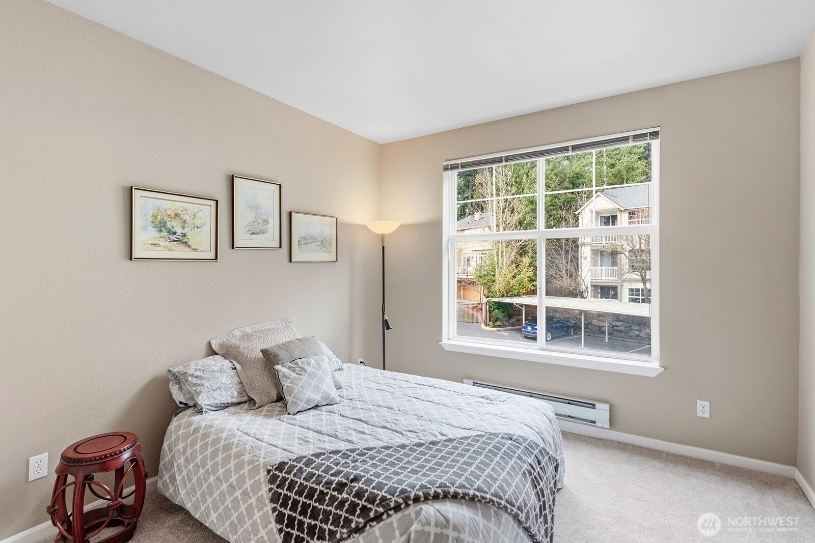 23420 Southeast Black Nugget Road, Unit F302 Issaquah, WA 98029 - Photo 12 of 19 a bedroom with a bed and a window