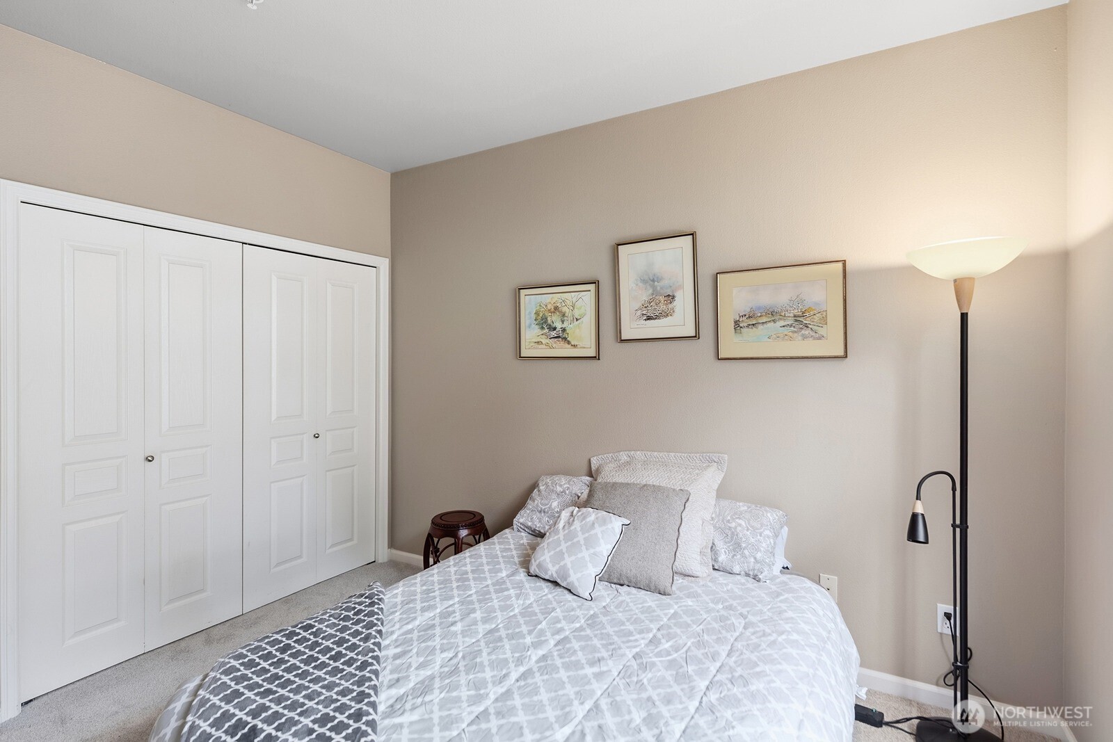 23420 Southeast Black Nugget Road, Unit F302 Issaquah, WA 98029 - Photo 13 of 19 a bedroom with a bed and a window