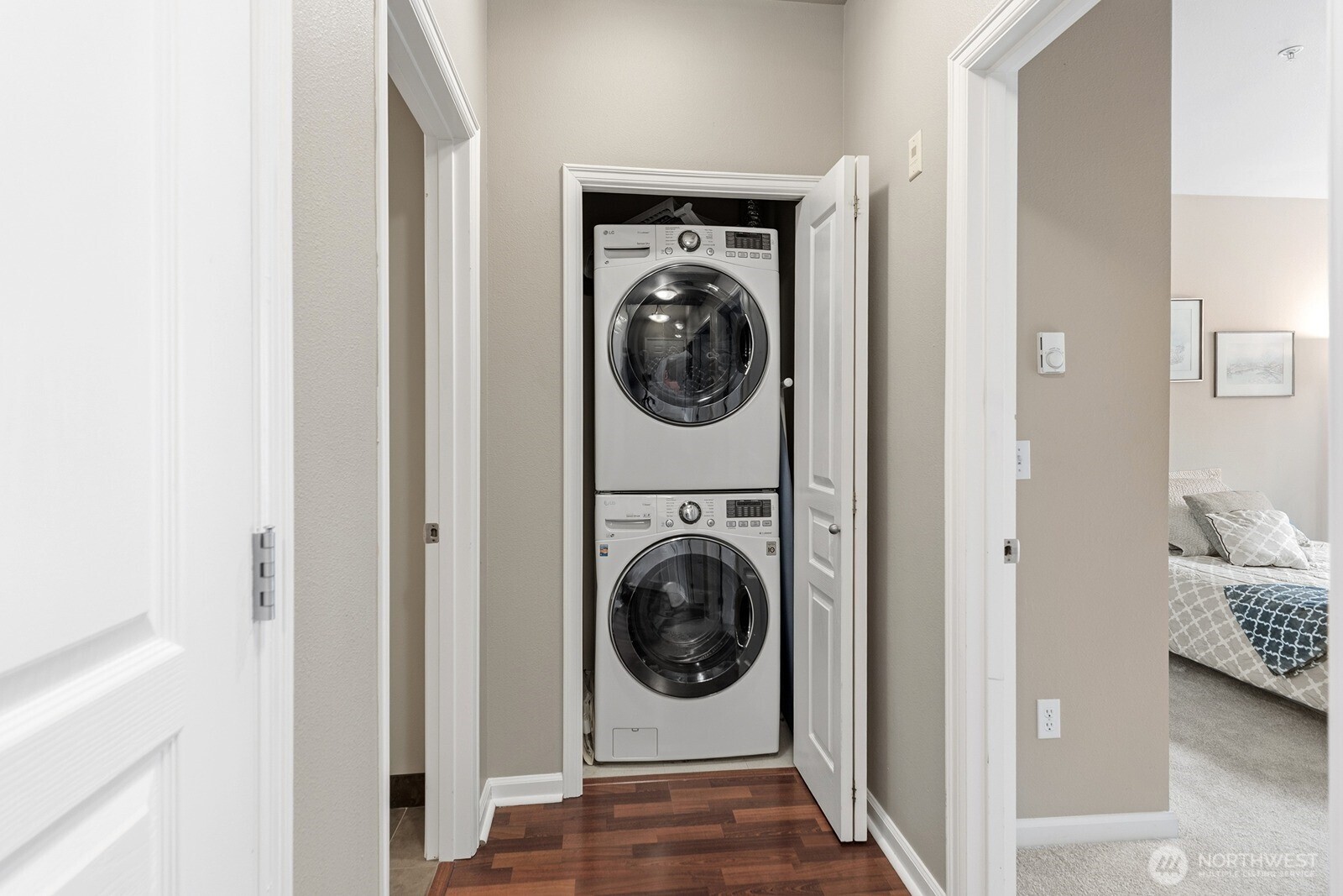 23420 Southeast Black Nugget Road, Unit F302 Issaquah, WA 98029 - Photo 16 of 19 a view of a hallway with washer and dryer