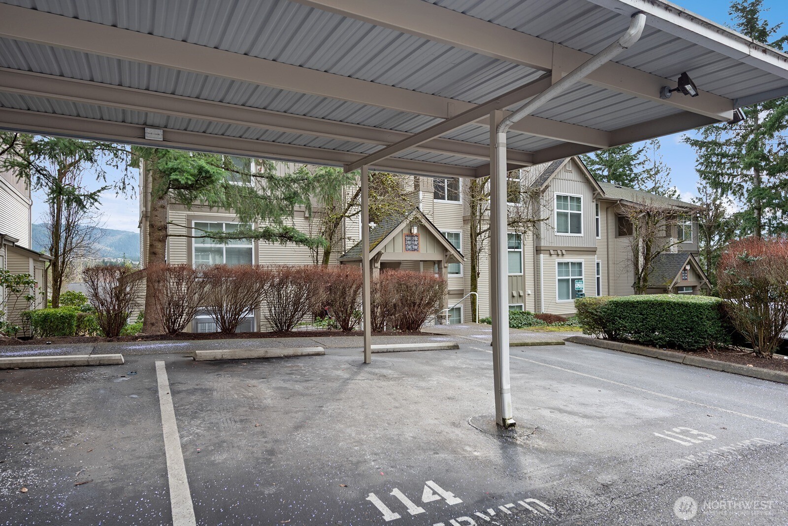 23420 Southeast Black Nugget Road, Unit F302 Issaquah, WA 98029 - Photo 17 of 19 a view of a house with a street