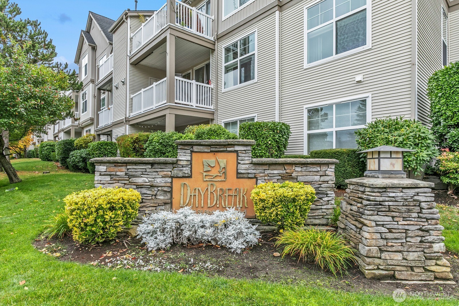 23420 Southeast Black Nugget Road, Unit F302 Issaquah, WA 98029 - Photo 2 of 19 a view of a chairs and table in backyard