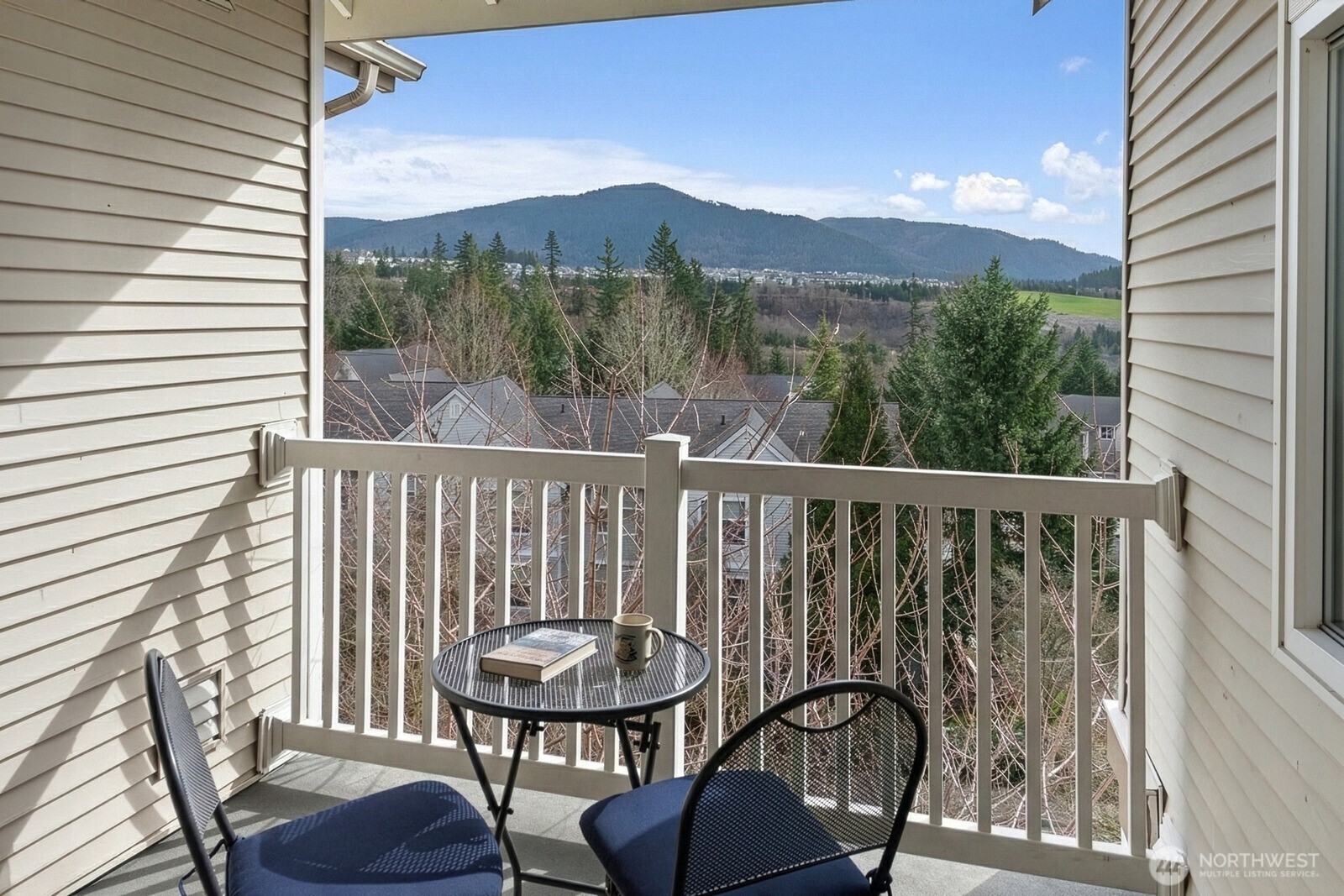 23420 Southeast Black Nugget Road, Unit F302 Issaquah, WA 98029 - Photo 5 of 19 a view of a chairs in balcony