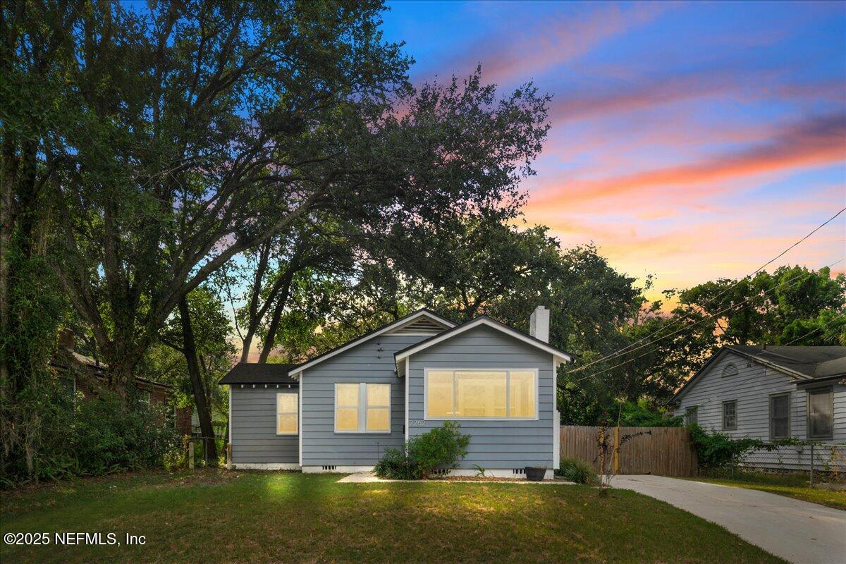 2262 Bayview Road Jacksonville, FL 32210 - Photo 1 of 27 a front view of a house with a yard and garage