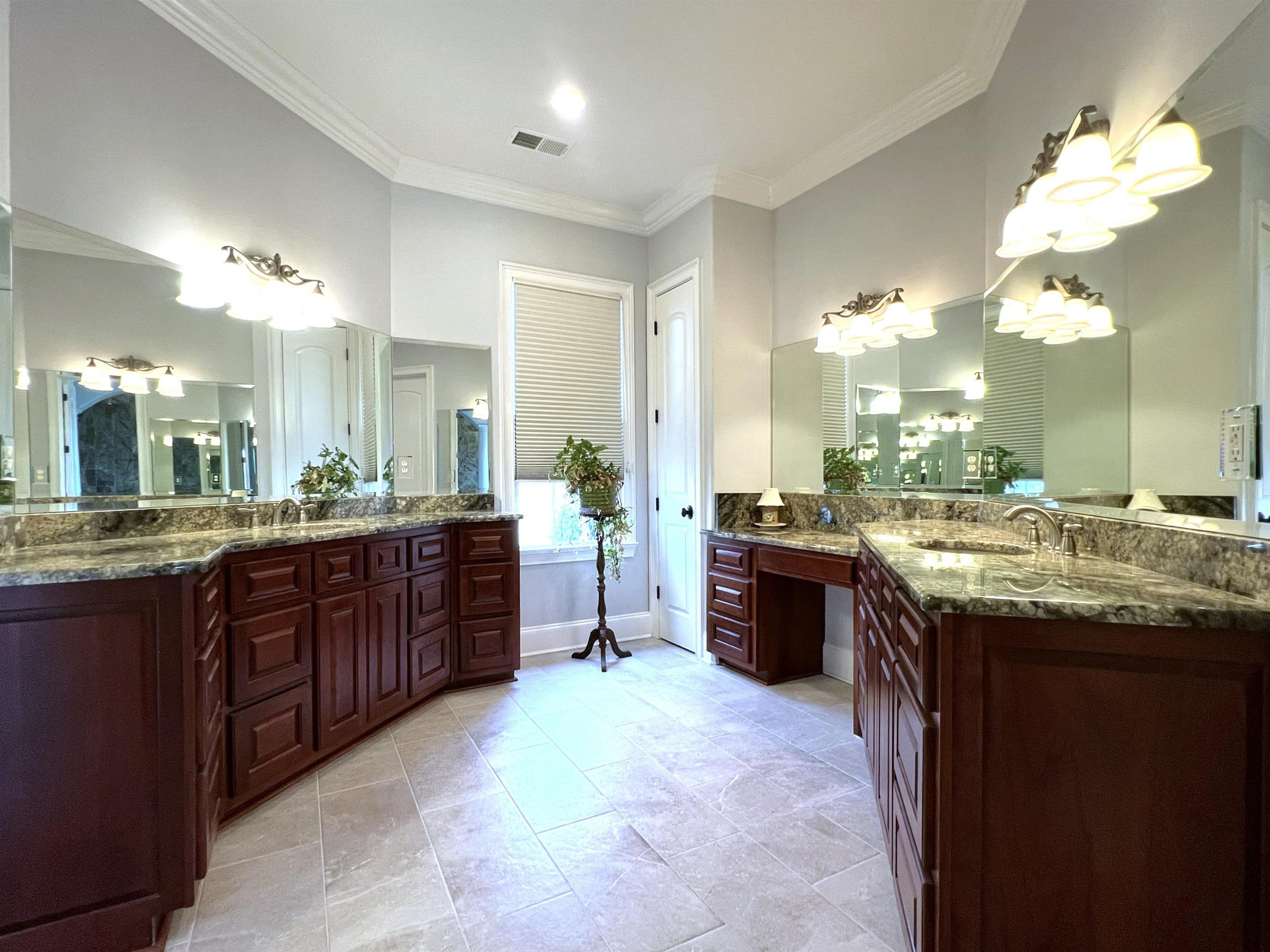 9125 Highway 196 Collierville, TN 38017 - Photo 18 of 40 a large bathroom with a granite countertop double vanity sink and a mirror