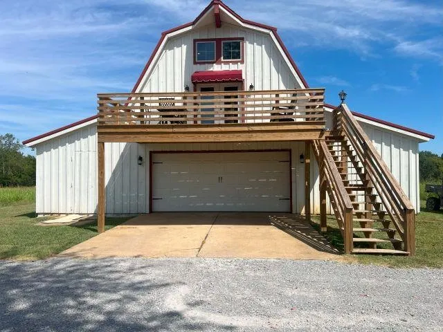 a view of a house with a small yard