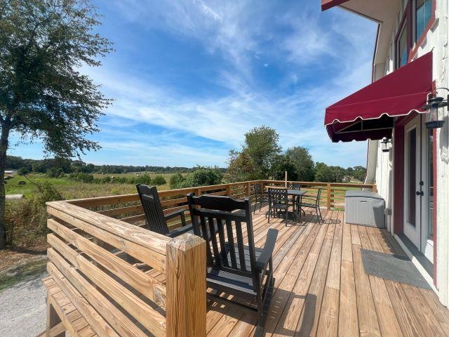 9125 Highway 196 Collierville, TN 38017 - Photo 38 of 40 a view of a roof deck with couches and wooden floor