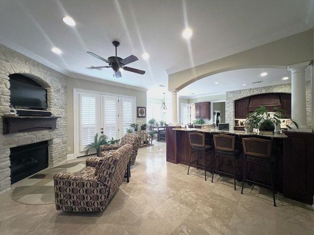 9125 Highway 196 Collierville, TN 38017 - Photo 9 of 40 a living room with furniture a flat screen tv and kitchen view