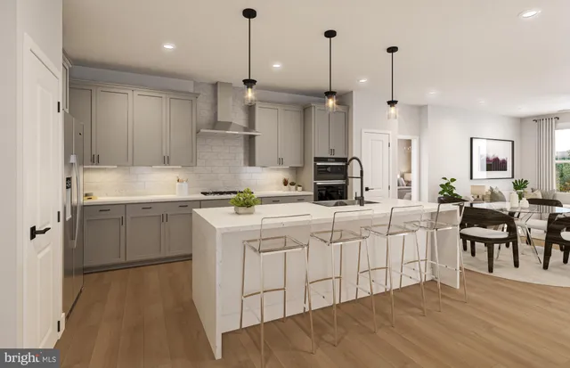 a dining room with furniture a chandelier and wooden floor