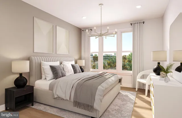 a bed room with a bed and a large window