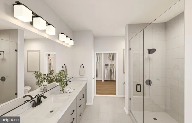 a bathroom with a tub sink mirror and shower