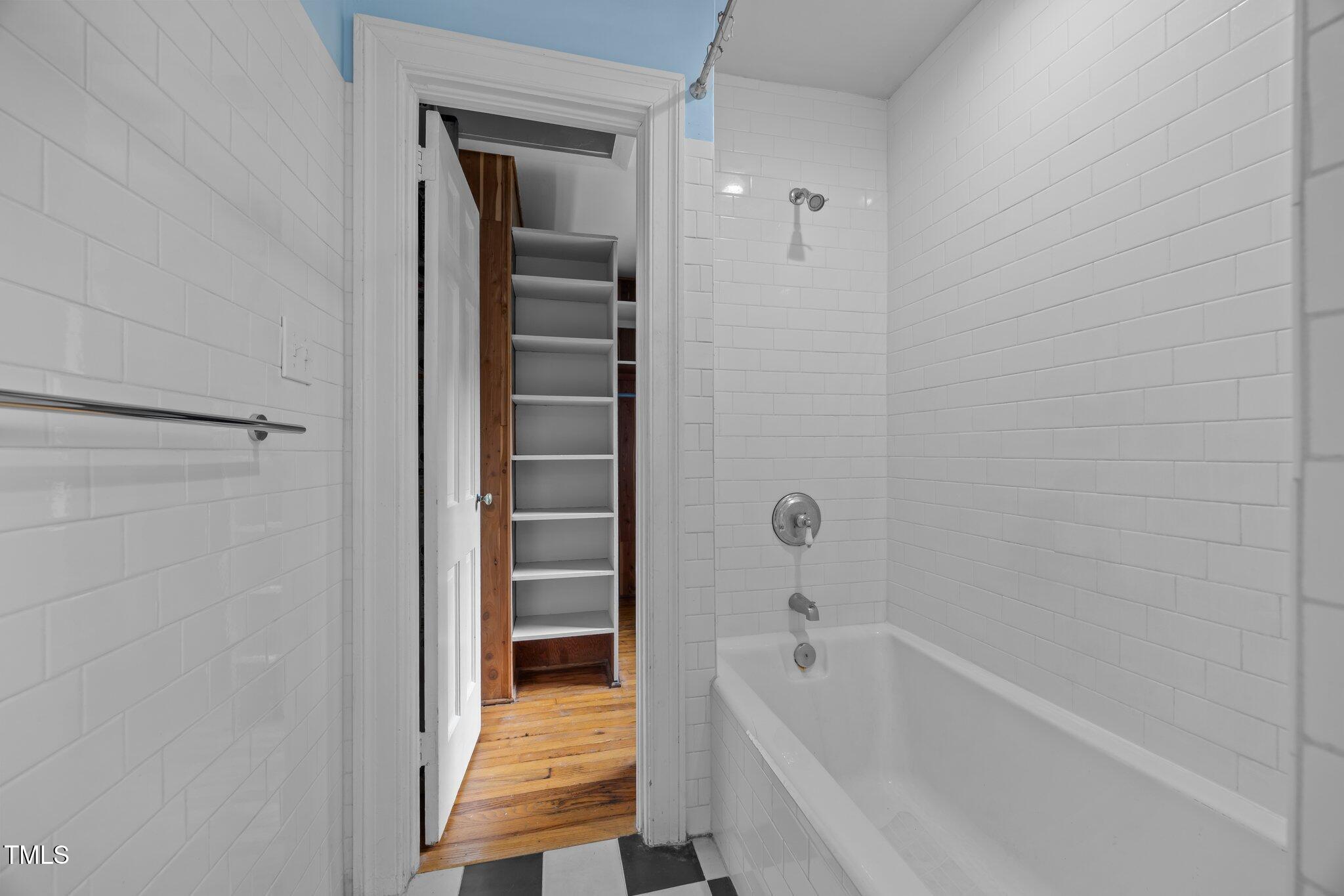 2625 Dover Road Raleigh, NC 27608 - Photo 15 of 57 a bathroom with a bathtub and a shower