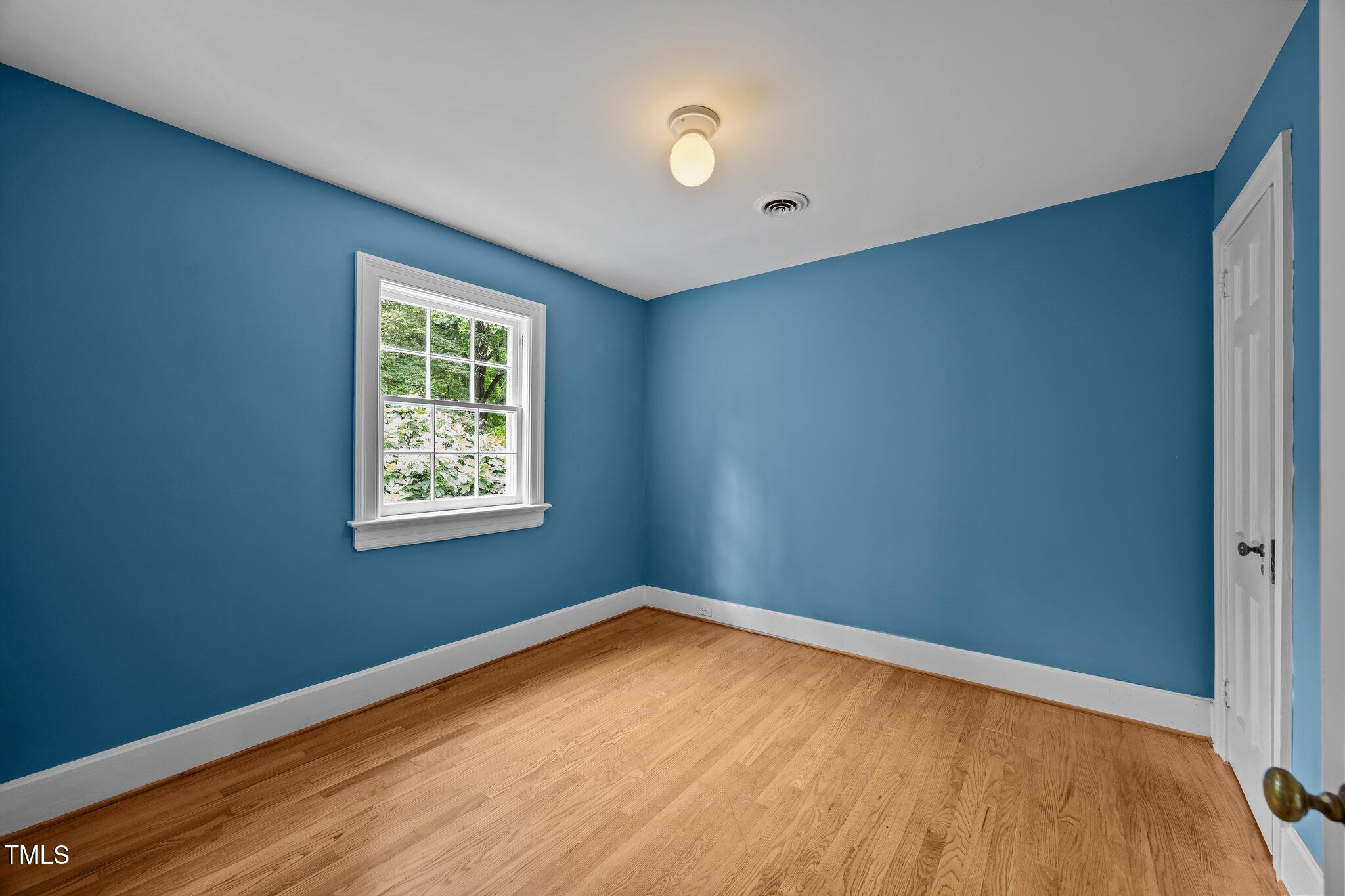 2625 Dover Road Raleigh, NC 27608 - Photo 16 of 57 an empty room with a window