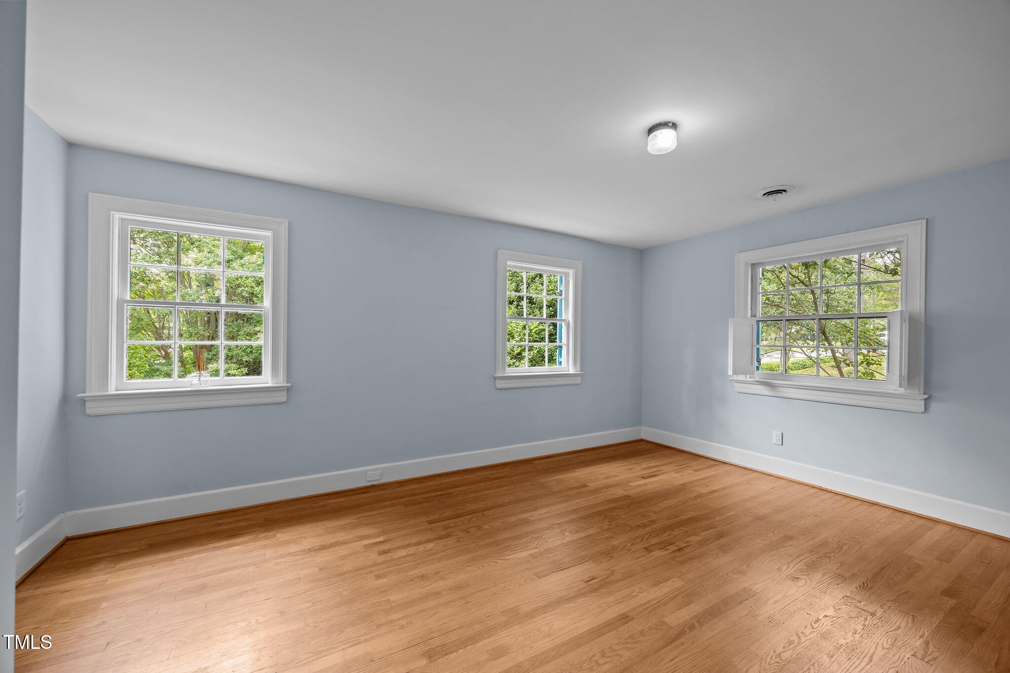 2625 Dover Road Raleigh, NC 27608 - Photo 17 of 57 an empty room with windows