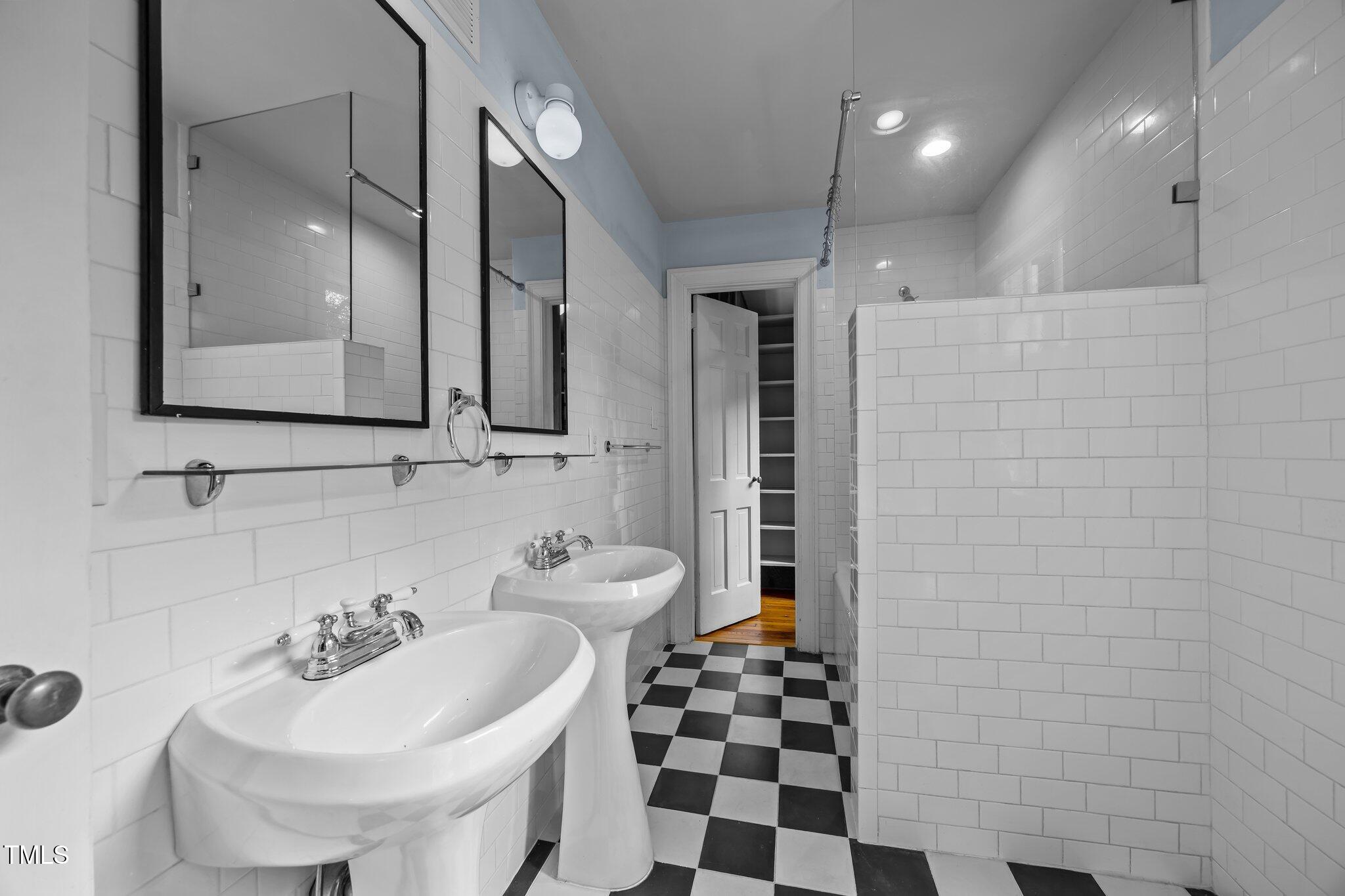 2625 Dover Road Raleigh, NC 27608 - Photo 18 of 57 a bathroom with a sink a toilet and shower